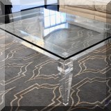 F08. Lucite frame coffee table with glass top. 16”h x 48”w x 30”d - $750